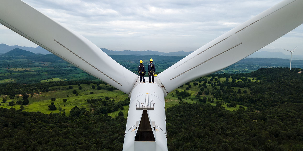 Engineers working near wind turbines